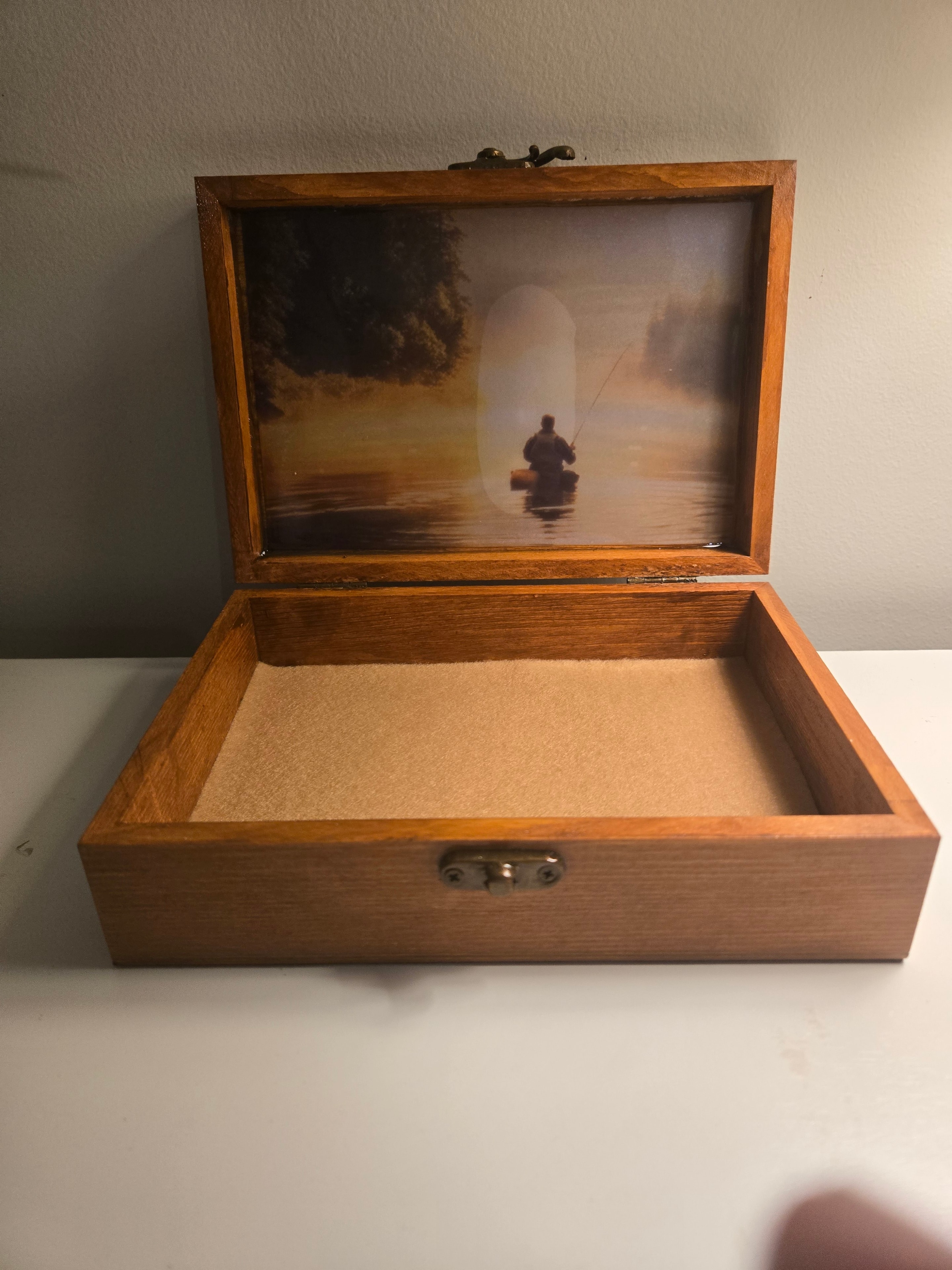 Wooden keepsake box with a fishing scene inside the lid